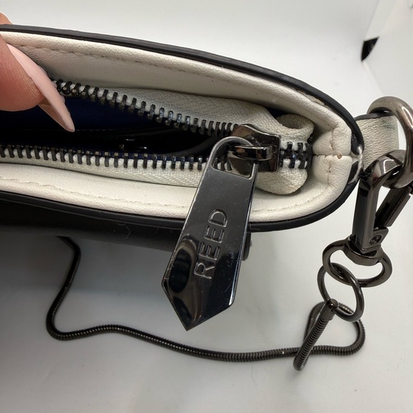 Reed Crossbody Purse Clutch featuring a removable metal chain strap Animal Print - Picture 7 of 9